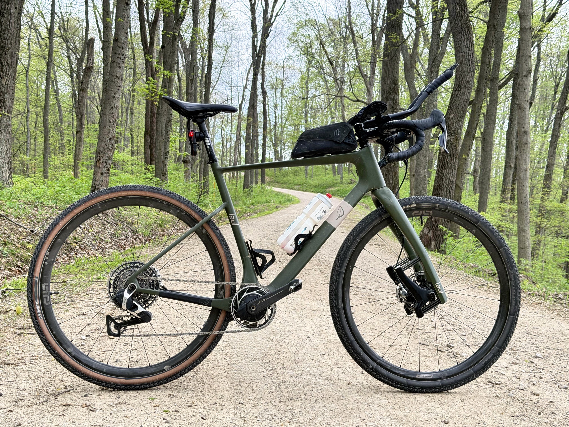 John Wintersteen's gravel bike on a wooded trail